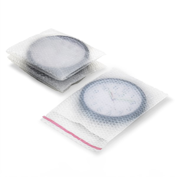 three clocks packed individually in plastic bubble bags