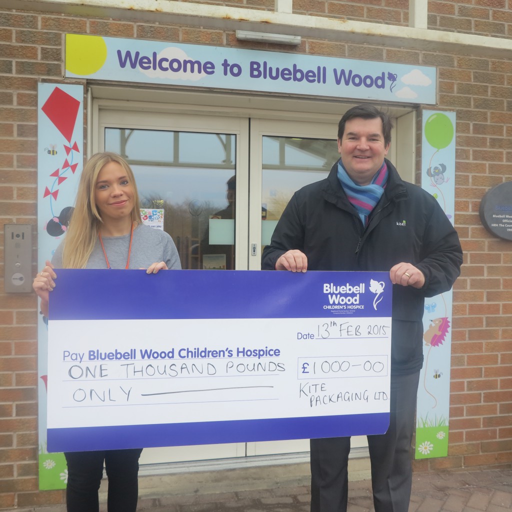 Chris OReilly, MP for Kite Packaging Northern presents a cheque to Bluebell Wood Hospice