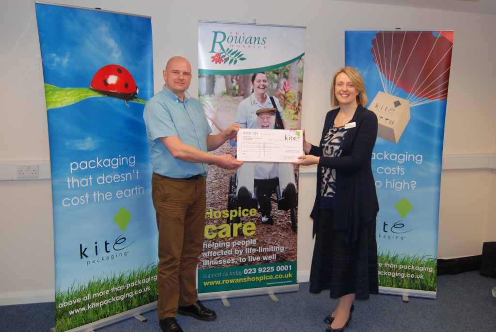 Chris Ireland, Office Manager at Kite Packaging South Coast presents cheque to Rowans Hospice